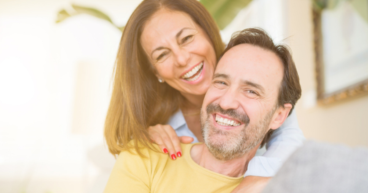 Beautiful couple happy that they dont have to go anymore to the hair salon