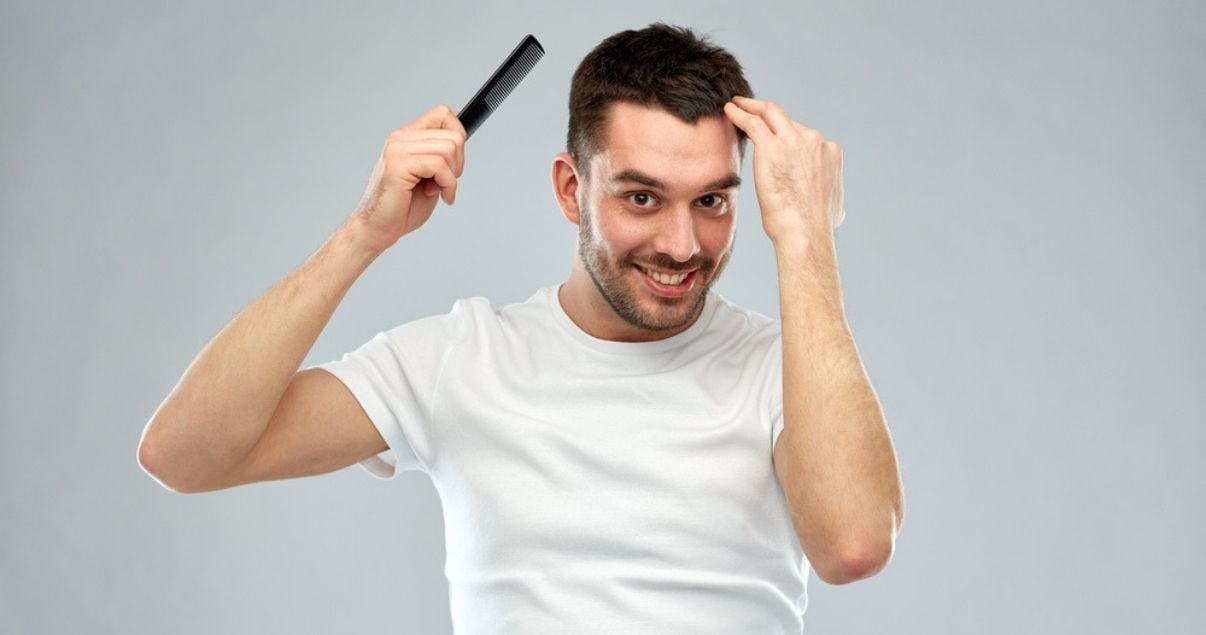 young_man_combing_hair