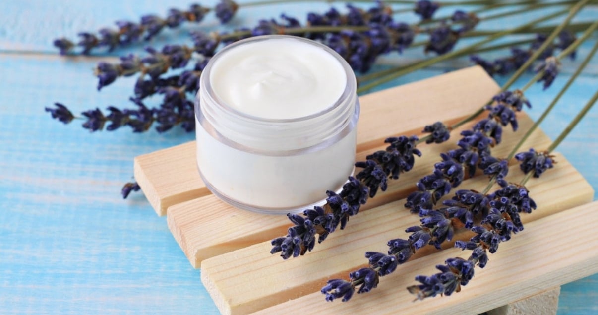 Homemade deep conditioner in a glass jar on wood with lavendar