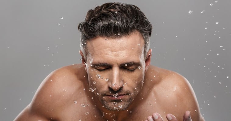 man slashing water before hair care