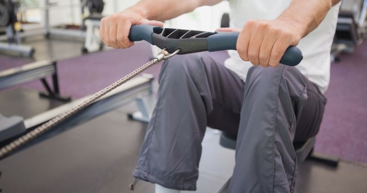 mature man working out at the gym confident in his hairpiece bond