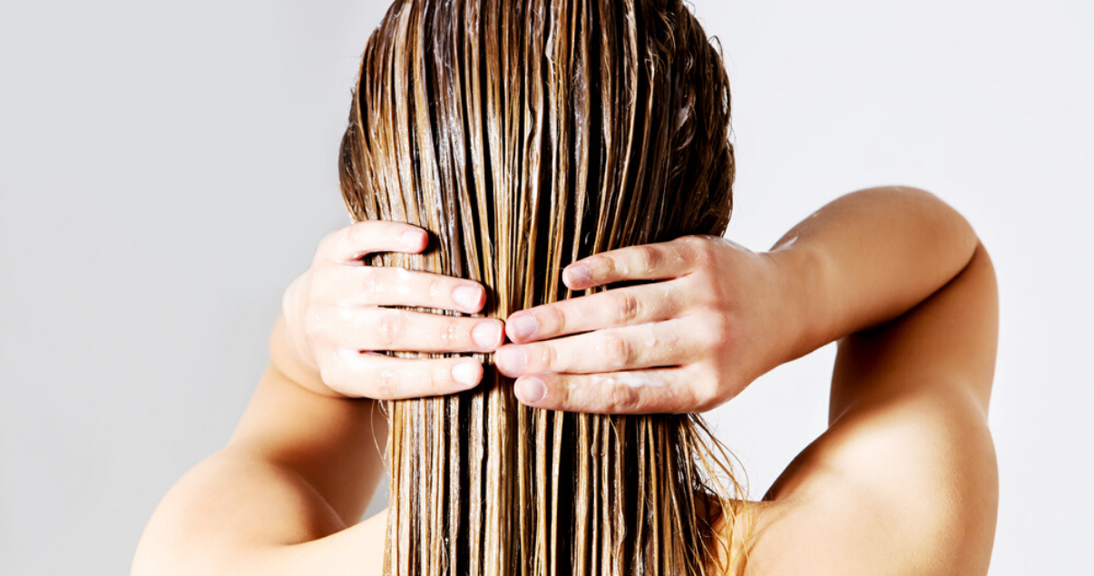 mature woman using hairpiece care measures to prevent damage from dying hairpiece