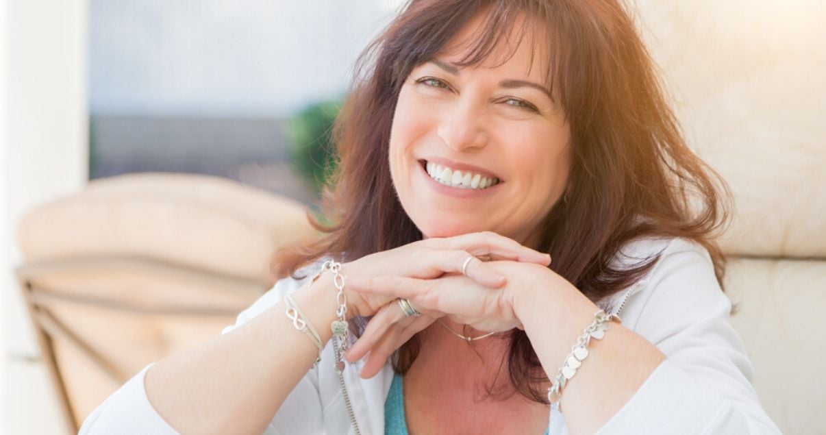 mature woman happy with her hair system maintenance