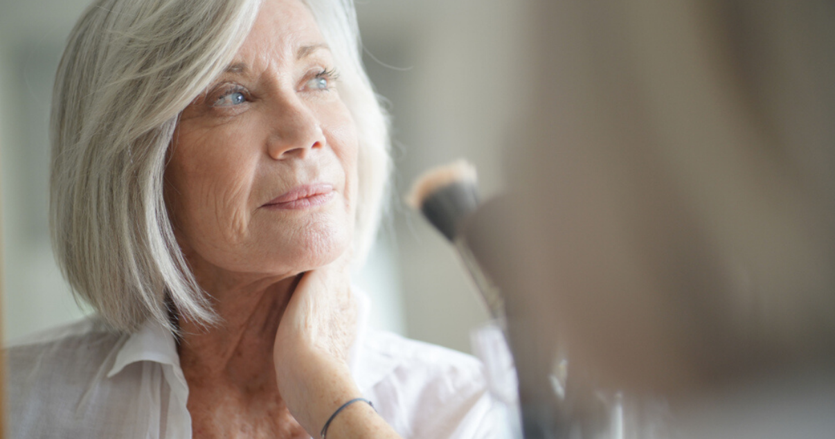 Mature woman touching stock hairpiece 