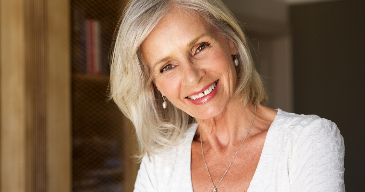 senior woman wearing best stock hairpiece after preparing scalp