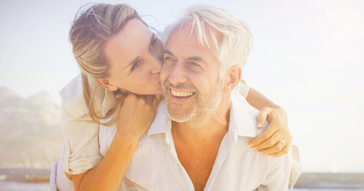 Mature man and woman happy with high quality hair system