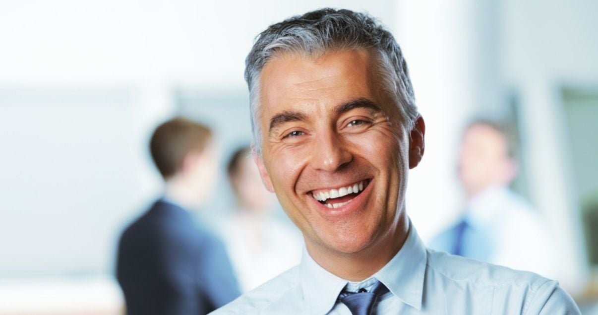 Mature business man wearing a toupee for men