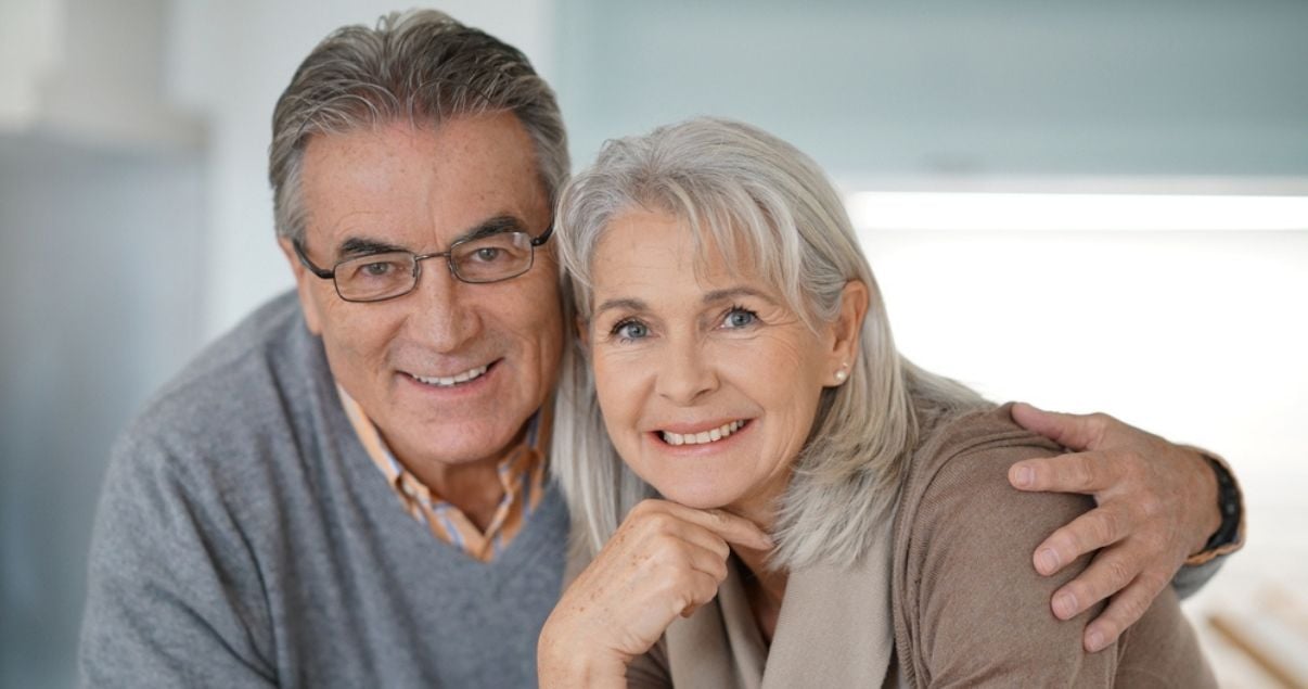 Senior couple wearing best hair replacement systems