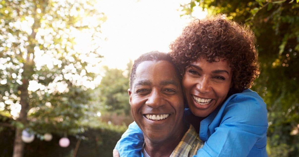 mature couple happy with their hair systems after removing hairpiece adhesive residue