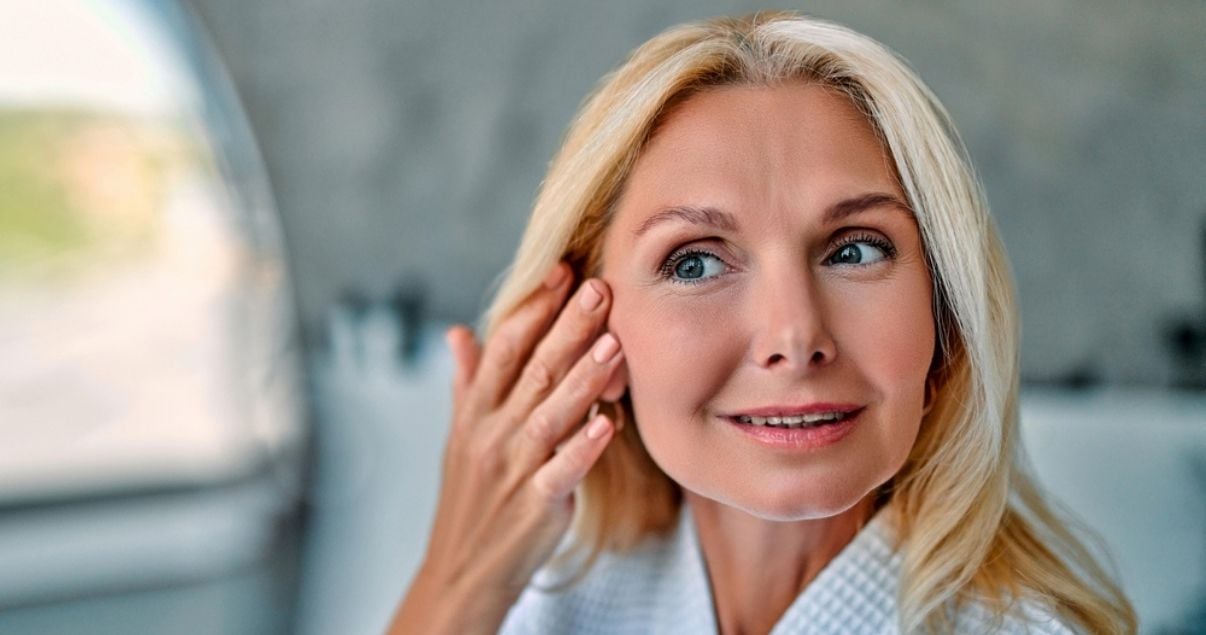 Mature blond woman wearing hair system