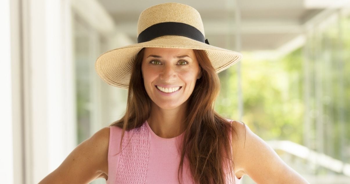 Middle aged brunette woman wearing best hair replacement system