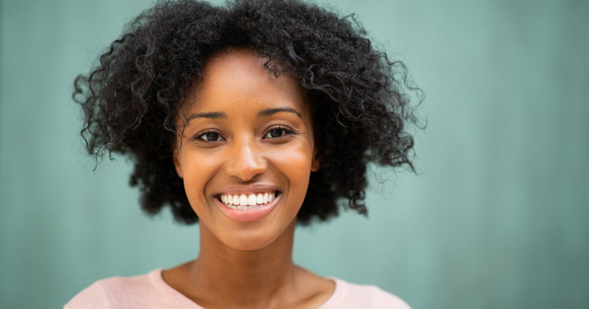 Happy middle age woman with her custom hair system