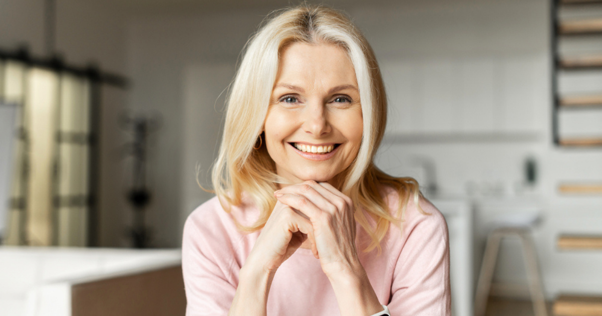 Happy middle age woman with her hair pieces (1)