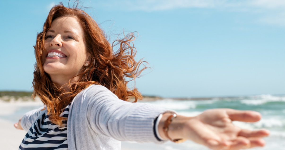 Happy woman with soft hair system