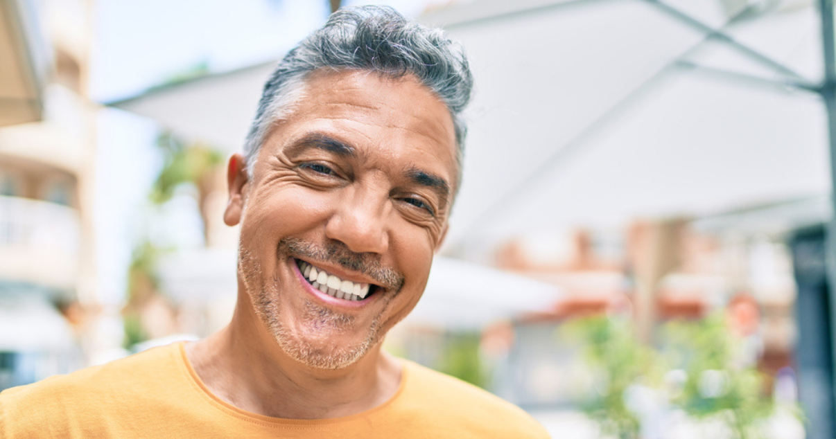 Man happy after deciding to use a bio matrix hairpiece