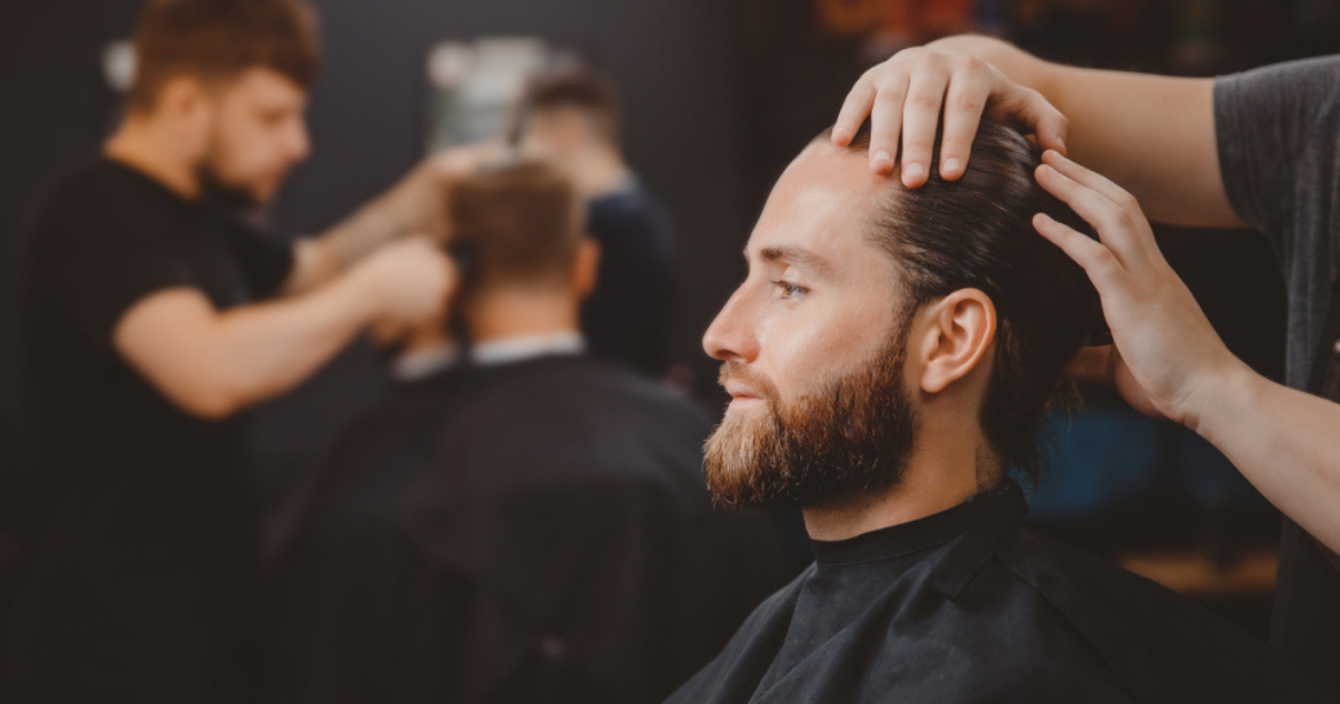 Man installing a hair piece at a hair salon. (1)