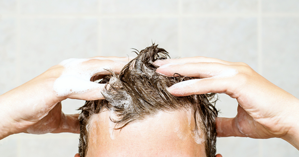 Man taking scalp care