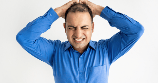 Man with irritation after reciving a hair transplant for men