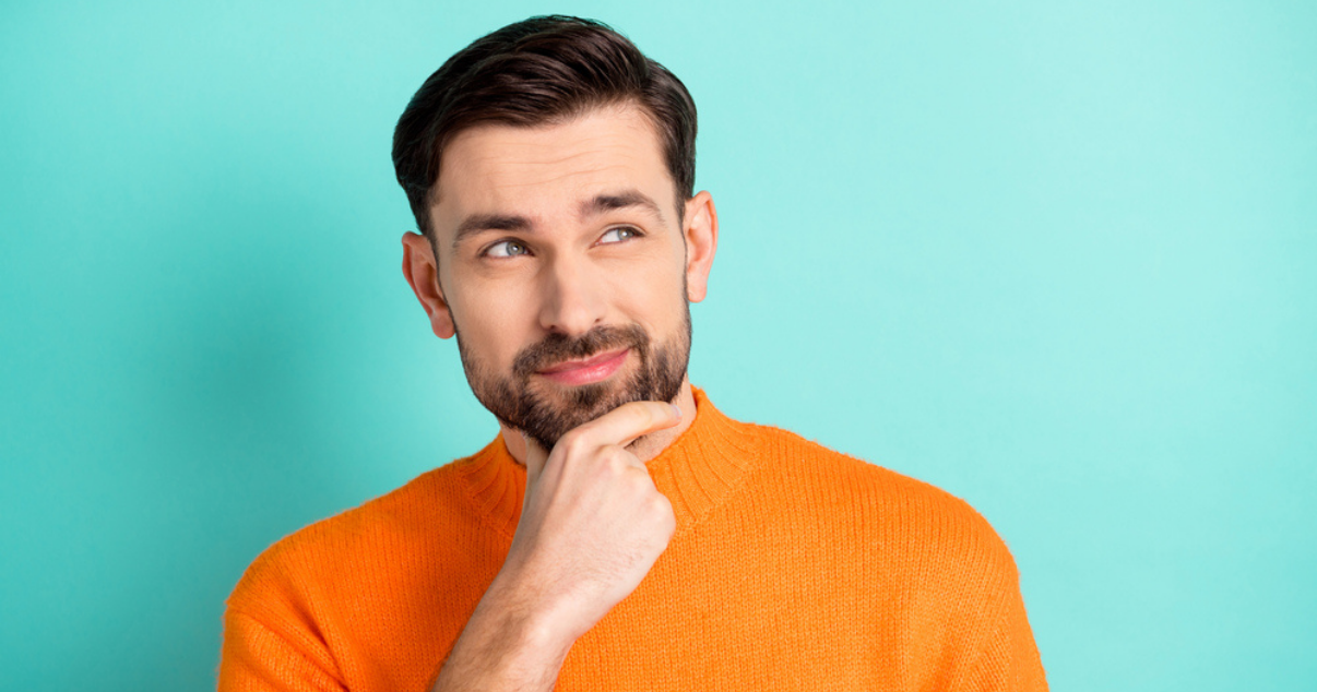 Man wondering if he should choose Advent Hair or go to a Hair Salon