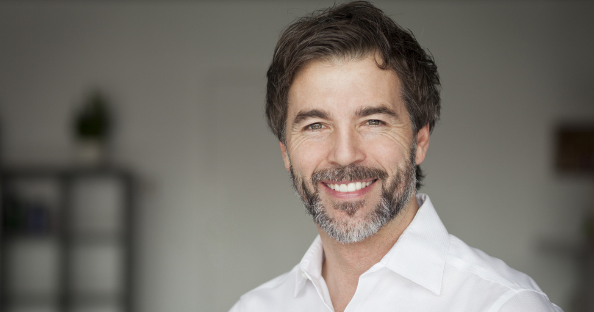 Mature man wearing natural hair wig