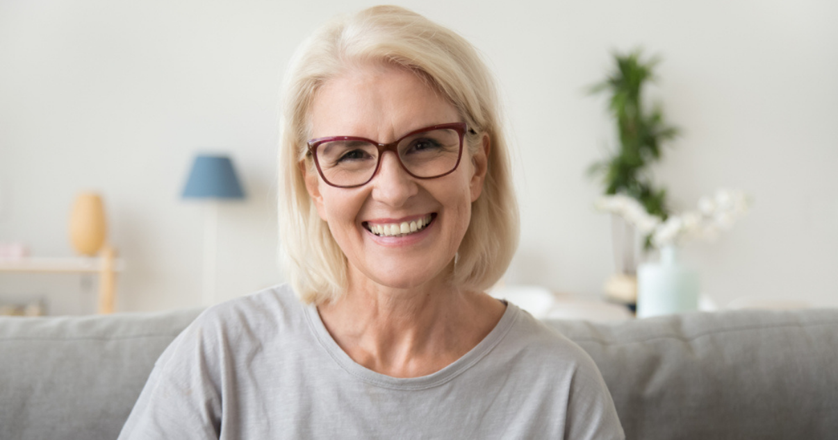 Mature woman using hair system adhesive