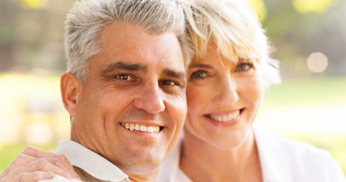 Middle age couple smiling with their hair system