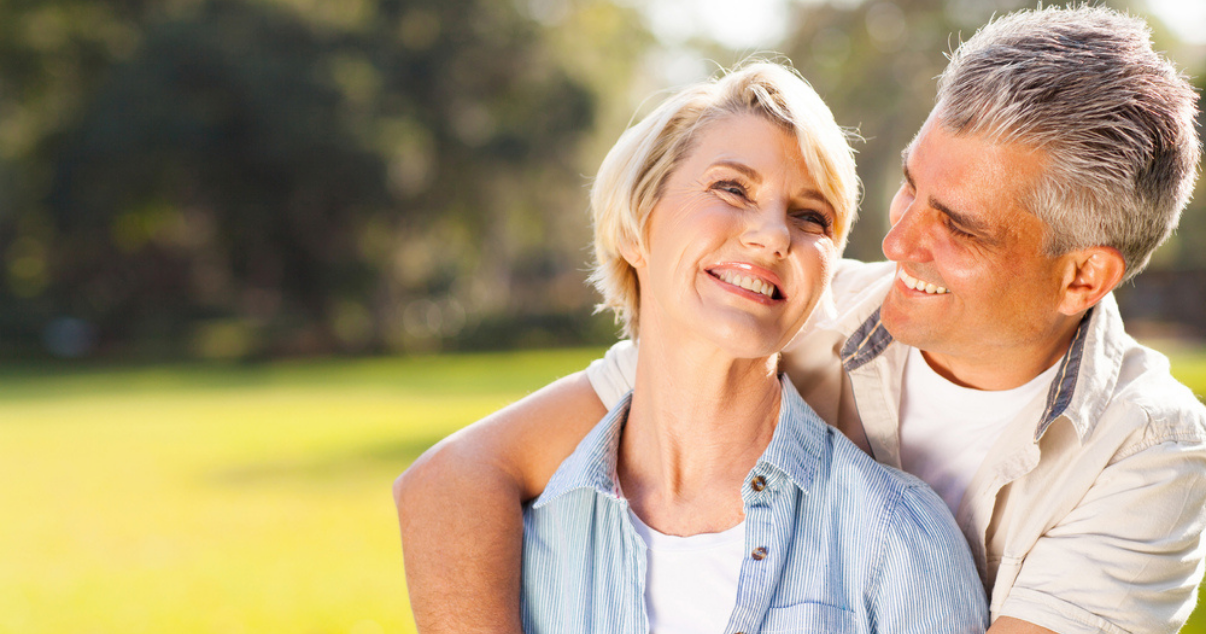 Middle age couple using a hairpiece and taking in the proper haircare tips.