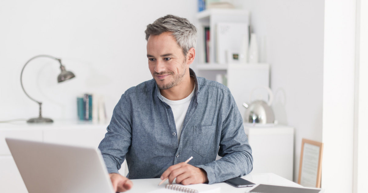 Middle aged man looking at Advent Hair website