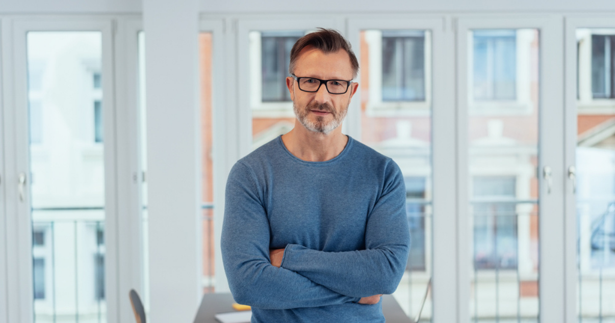 Middle aged man wearing a Hair System 