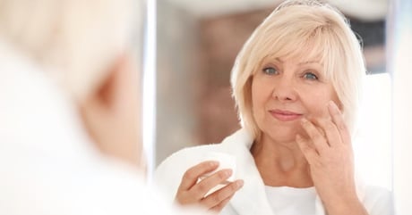 Middle aged woman thinking about leaving hair club