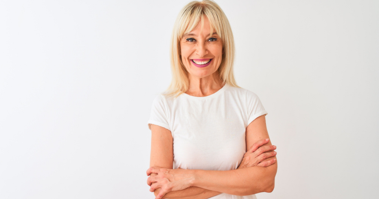 Senior woman happy because shes able to wear hair systems and not get surgery 