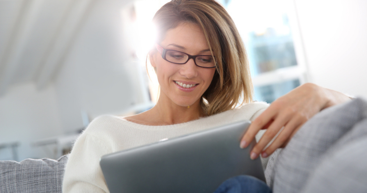 Woman browsing Advent Hair for hair systems