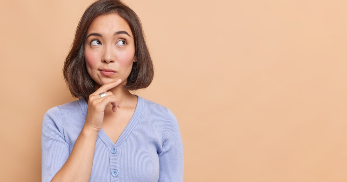 Woman doubting how many times a year she should buy a hairpiece (2)