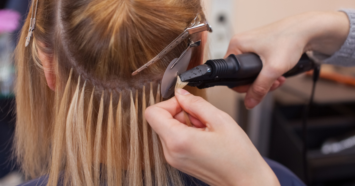 Woman putting on her hair extensions  (1)