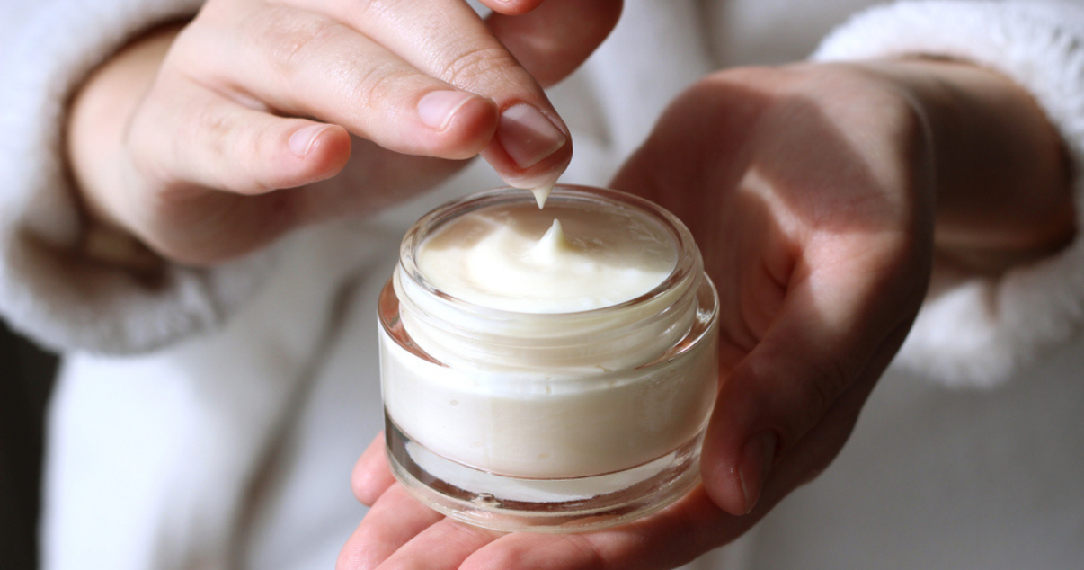 Woman using styling cream.