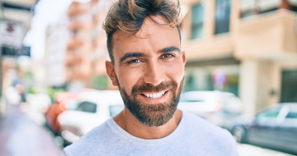 Young man happy that his wig is in great shape-png