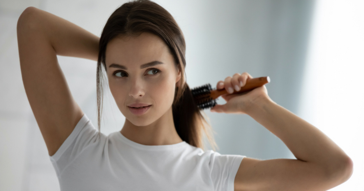 Young woman trying new hairdos