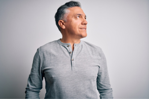 Confident man wearing a custom hair system 