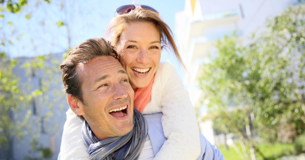 Couple enjoying their hairpiece thanks to their wig supplies
