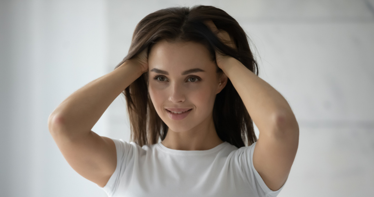 Girl trying her custom hairpiece