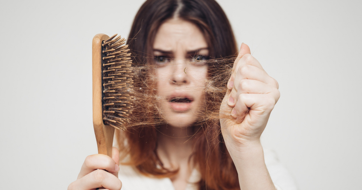 Sad woman because shes suffering hair loss